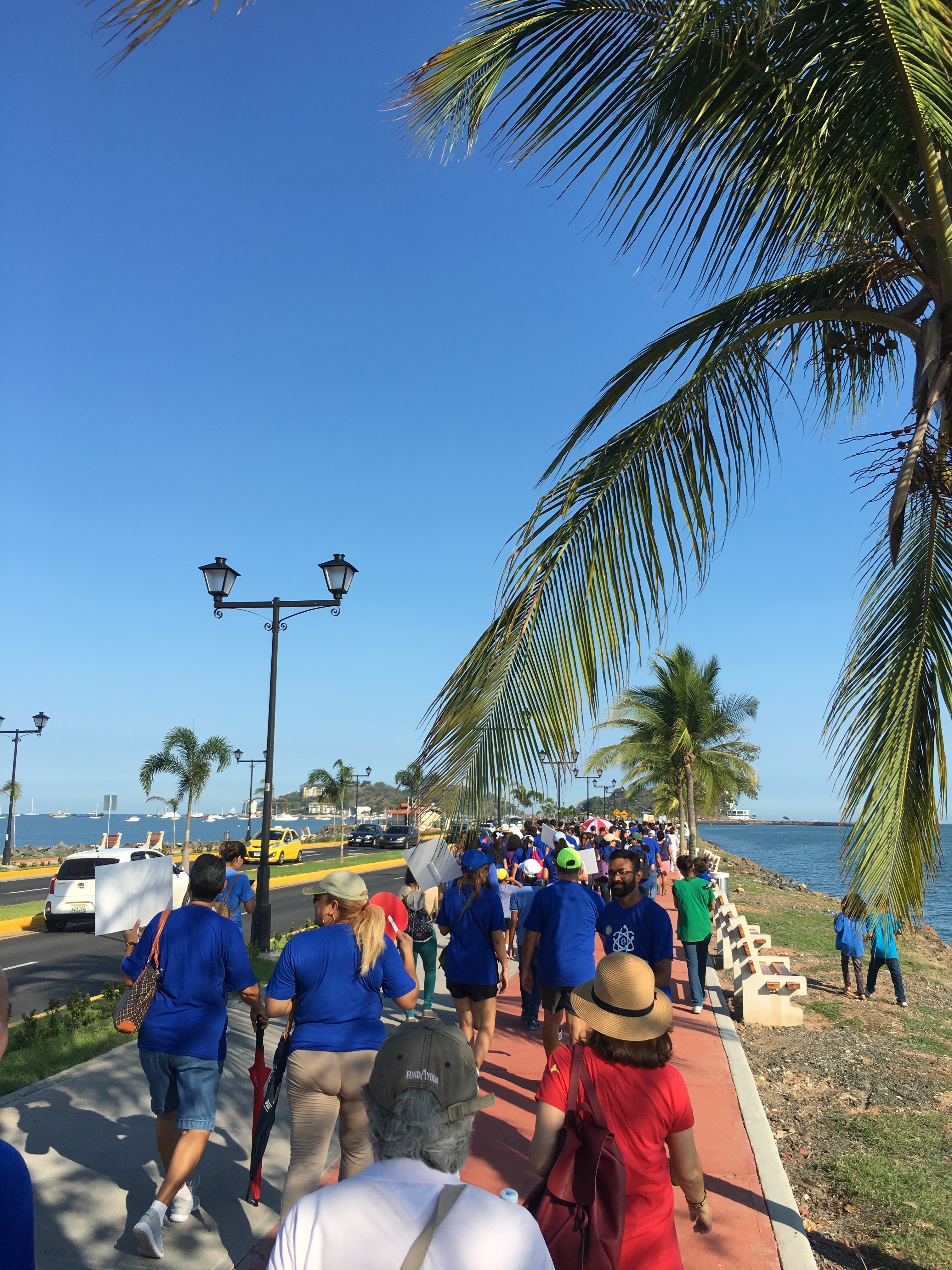 Science supporters walking together during the Caminata por la Ciencia down Amador Causeway, Panama City, Panama.