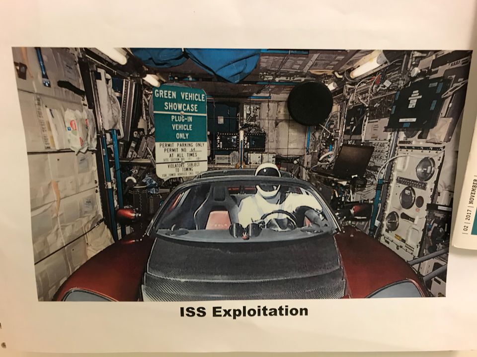 Photo showing a red Tesla parked on the International Space Station