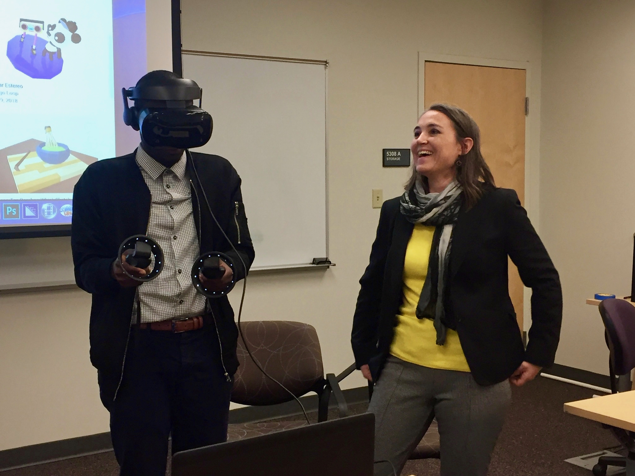 An undergraduate student member of the STS Futures Lab tries out the virtual reality headset