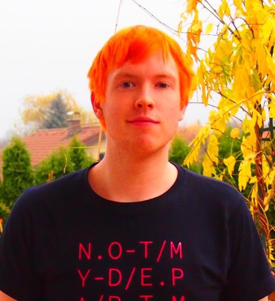 Picture of Gabriel Grill (orange leaves are in the background of the picture which match Gabriel's orange hair)