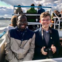 Two undergraduate STEM student members of the STS Futures Lab on a ferry in Helsinki, where they co-presented STS research with Lab co-PIs Emily York and Shannon N. Conley